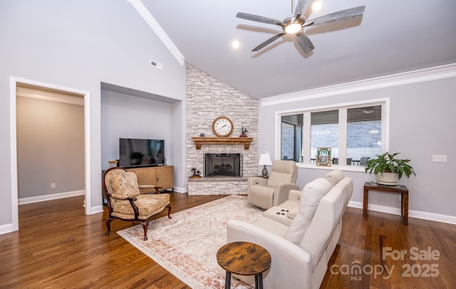 living room with a fireplace, dark wood-type flooring, ceiling fan, and crown molding