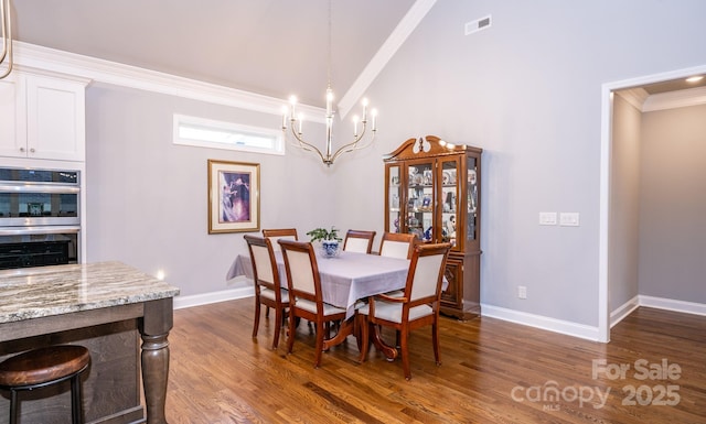 dining room with a chandelier, crown molding, high vaulted ceiling, and dark wood-type flooring