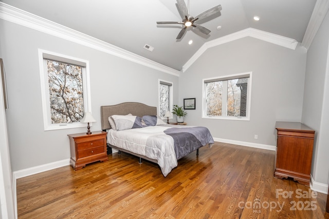 bedroom with multiple windows, ceiling fan, crown molding, and vaulted ceiling