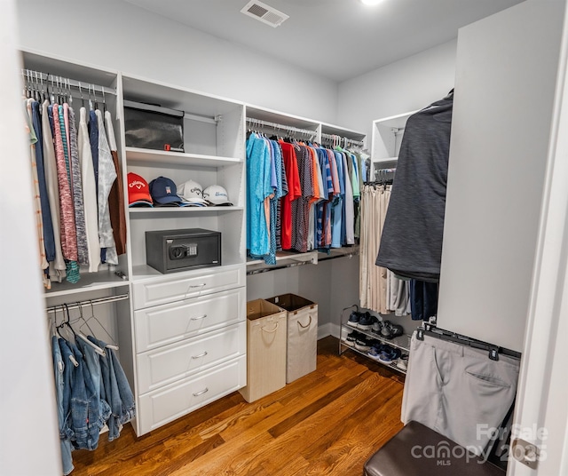 spacious closet featuring hardwood / wood-style floors