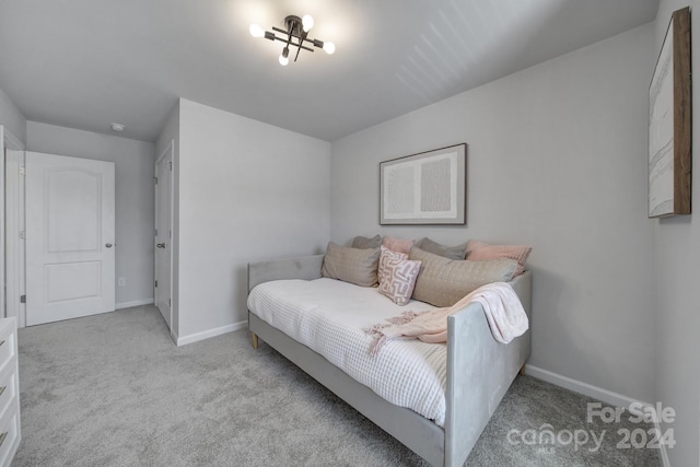 bedroom featuring light colored carpet