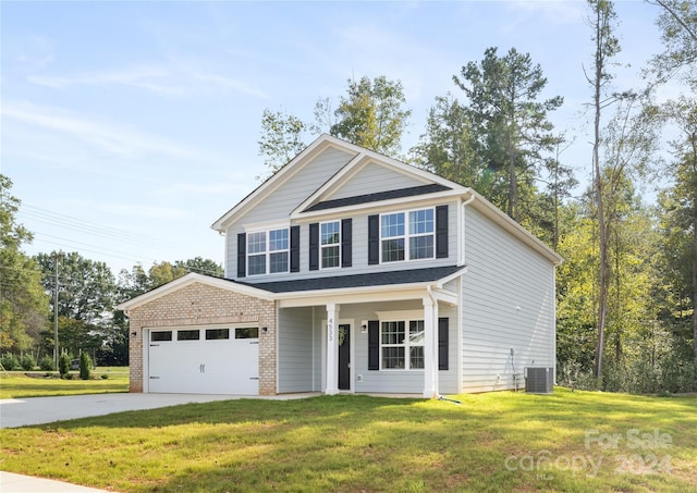 view of front of home with covered porch, central AC unit, a front lawn, and a garage