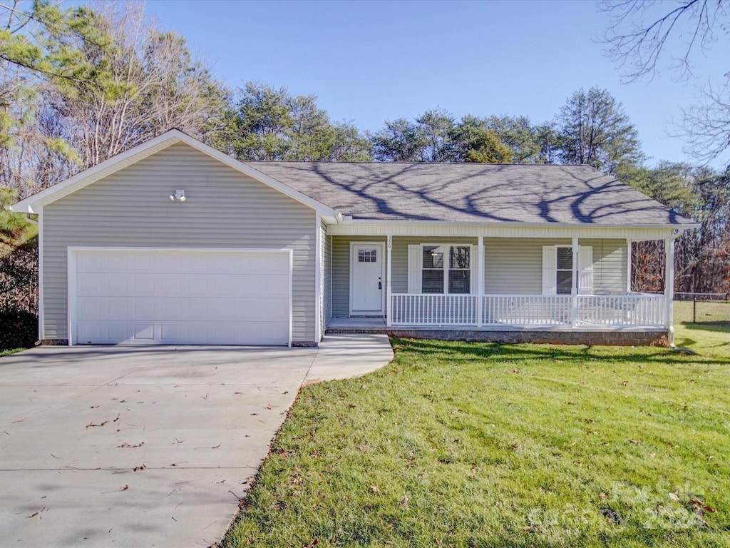 single story home with a front yard, a porch, and a garage