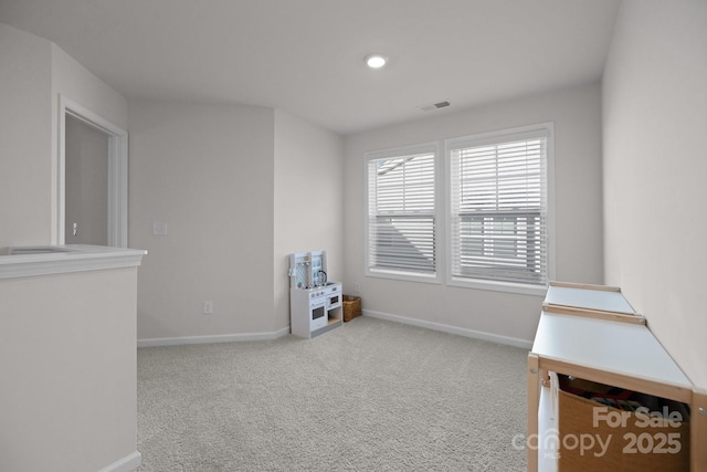 recreation room with visible vents, baseboards, and carpet floors