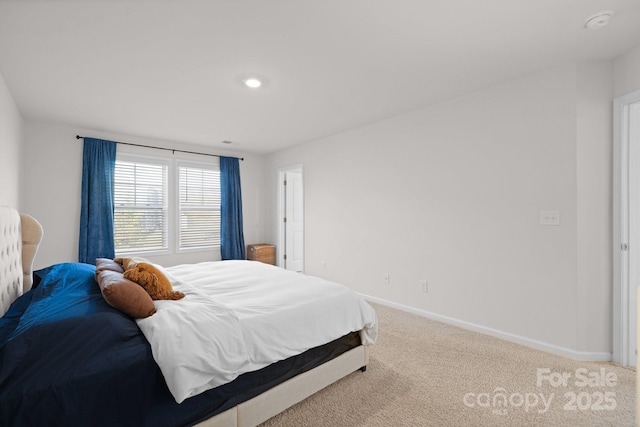 bedroom with carpet and baseboards