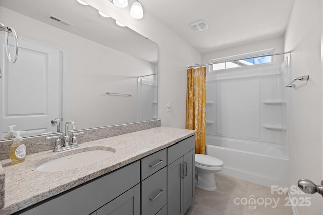 bathroom with tile patterned floors, visible vents, toilet, and vanity