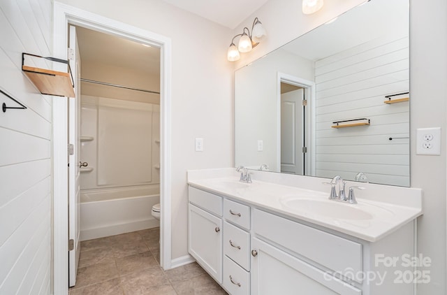 full bathroom with washtub / shower combination, vanity, and toilet