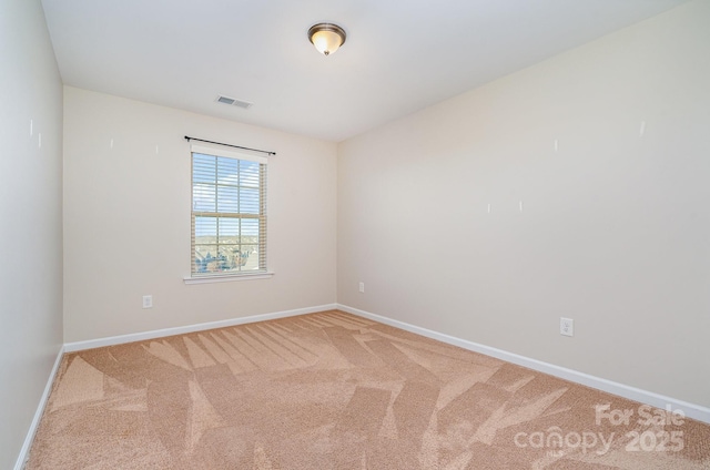 spare room featuring carpet flooring