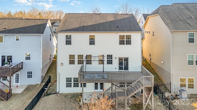 rear view of property featuring cooling unit