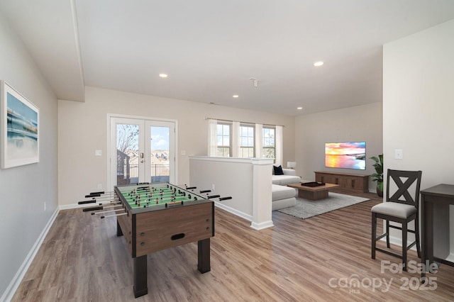 playroom featuring french doors and light hardwood / wood-style flooring