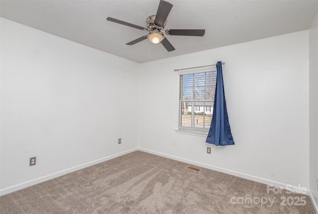 unfurnished room featuring ceiling fan and light colored carpet