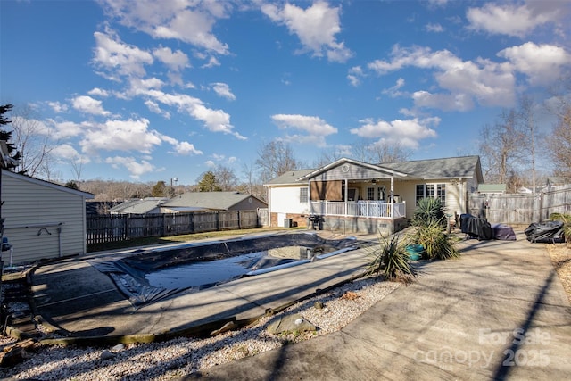 view of pool with a patio area and a porch