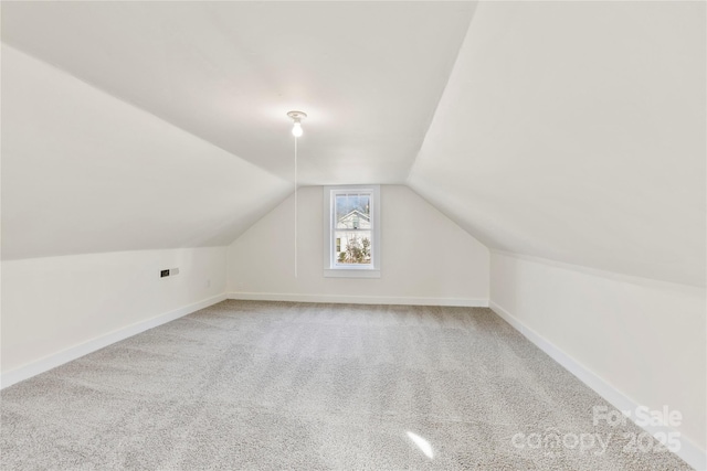 additional living space with lofted ceiling and carpet floors