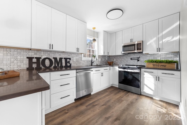 kitchen with white cabinetry, sink, and stainless steel appliances