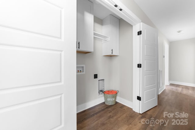 laundry room with dark wood-type flooring, hookup for a washing machine, and cabinets