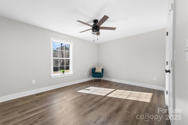 unfurnished room with dark hardwood / wood-style floors and ceiling fan