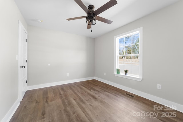 empty room with hardwood / wood-style flooring and ceiling fan