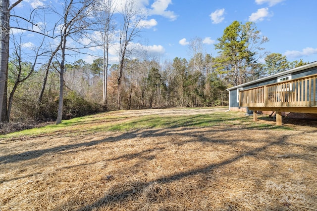 view of yard with a wooden deck