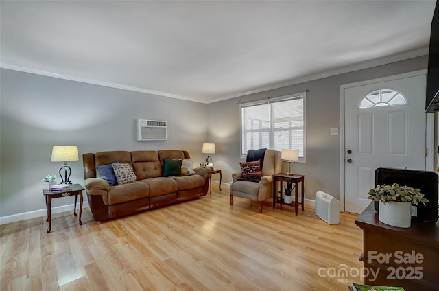 living room with light hardwood / wood-style flooring, a wall mounted air conditioner, and crown molding