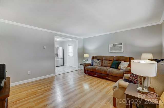 living room featuring a wall mounted AC, light hardwood / wood-style floors, and crown molding