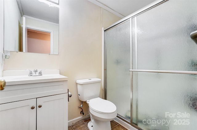 bathroom featuring toilet, tile patterned flooring, crown molding, an enclosed shower, and vanity