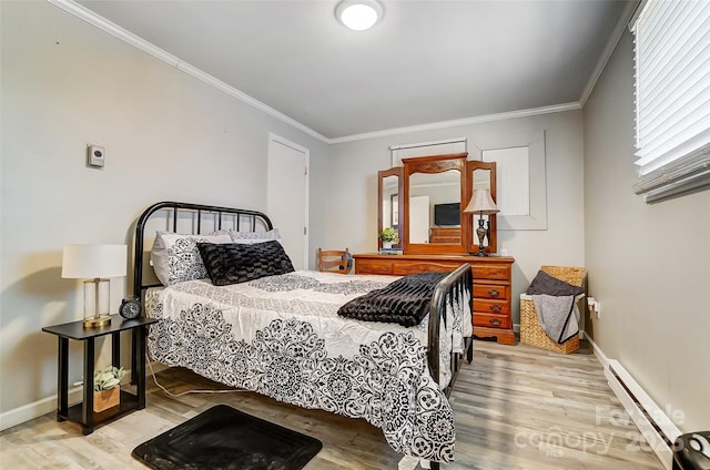 bedroom featuring a baseboard heating unit, crown molding, and light hardwood / wood-style flooring