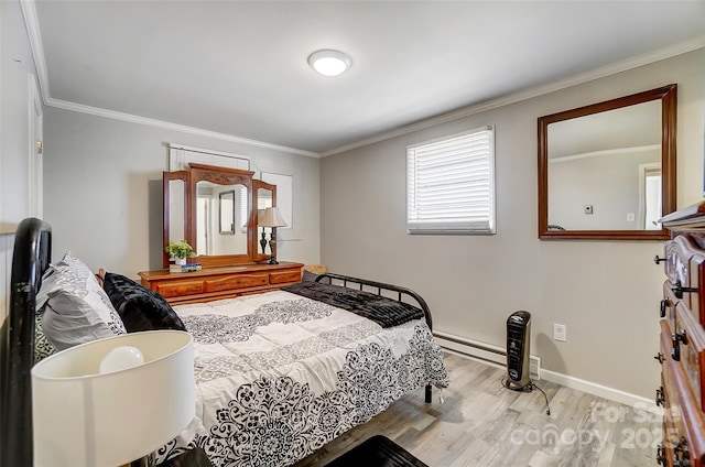 bedroom featuring a baseboard heating unit, ornamental molding, and light hardwood / wood-style floors