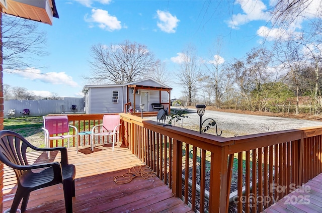 wooden deck featuring an outbuilding