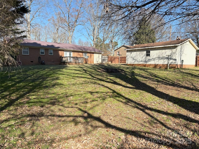 view of yard with a deck