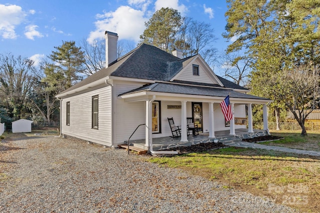 view of front of house featuring a front yard and covered porch