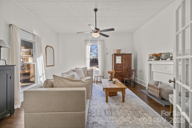 living room with dark hardwood / wood-style floors and ceiling fan