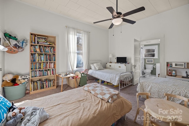 bedroom featuring ceiling fan, ornamental molding, and carpet floors