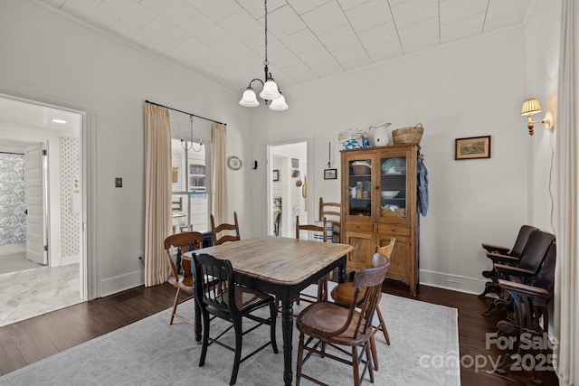 dining area featuring dark hardwood / wood-style floors