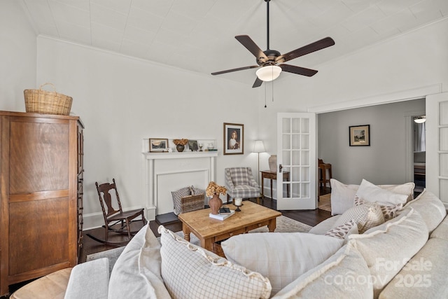 living room featuring crown molding, dark hardwood / wood-style floors, ceiling fan, and french doors