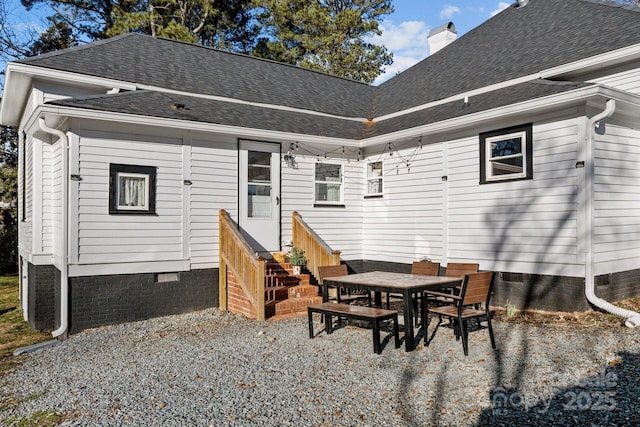 back of property with a patio