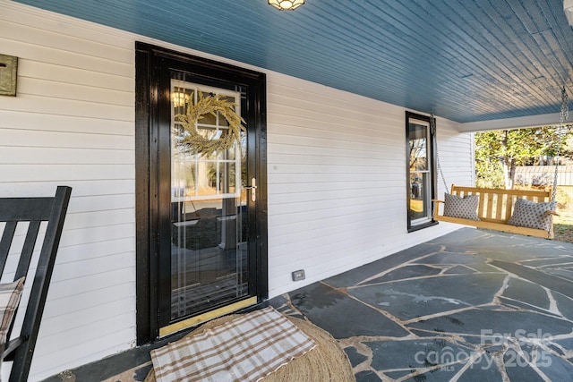 property entrance featuring covered porch