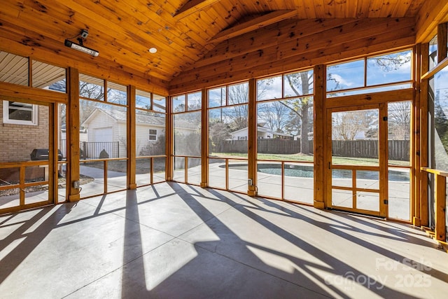 unfurnished sunroom featuring lofted ceiling and wood ceiling