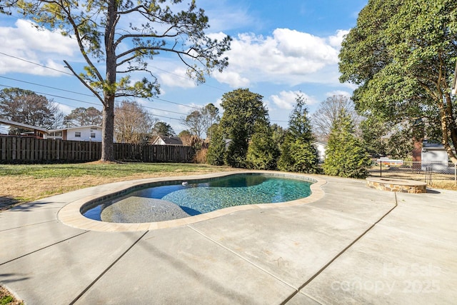 view of swimming pool with a lawn and a patio