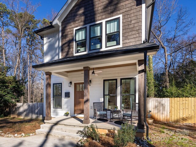 view of front of home with a porch and ceiling fan