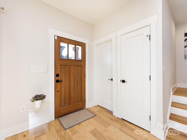 entryway with light hardwood / wood-style floors