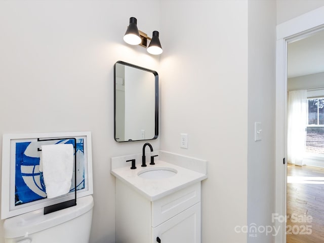 bathroom with vanity and toilet