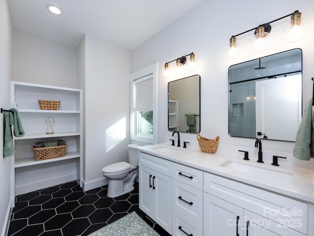 bathroom featuring tile patterned floors, a shower, vanity, and toilet