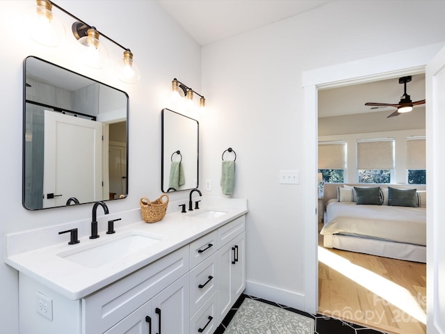 bathroom featuring ceiling fan and vanity