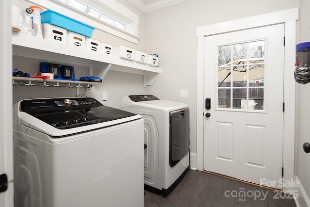 laundry area featuring ornamental molding and independent washer and dryer