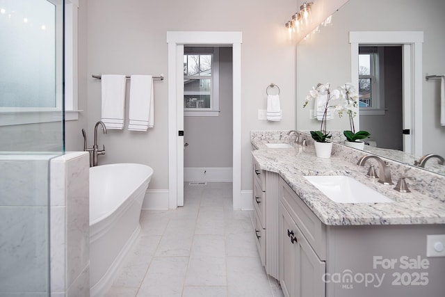 bathroom with a bathtub and vanity