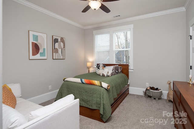 carpeted bedroom featuring ceiling fan and crown molding