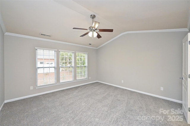 carpeted empty room with crown molding, ceiling fan, and lofted ceiling