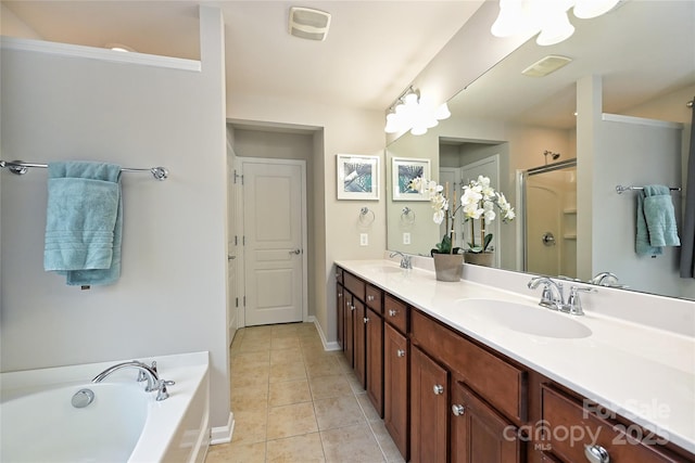 bathroom featuring tile patterned flooring, vanity, and independent shower and bath