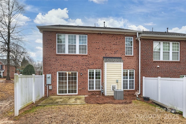 back of property with a patio area and central AC unit