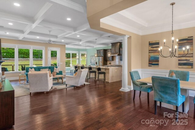 dining area featuring coffered ceiling, crown molding, dark hardwood / wood-style floors, beam ceiling, and decorative columns